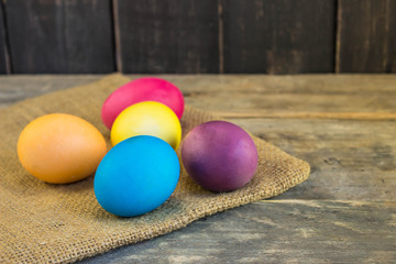 Painted easter eggs on wooden planks