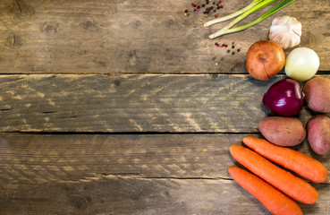 Raw vegetables on vintage wooden planks - autumn harvest . with copy space