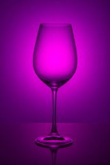 Wine glass on color background