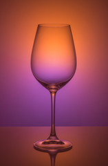 Wine glass on color background