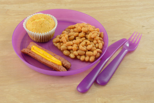 Lunch Of Hot Dog, Beans And Corn Muffin Om Plastic Picnic Plate