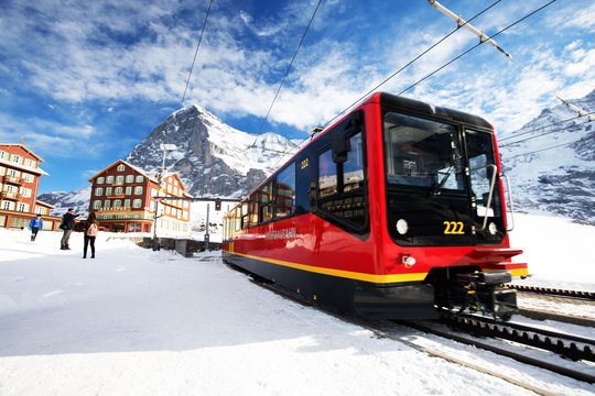 Kleine Scheidegg train station under Jungfrau, Monch and Eiger peaks in Swiss Alps, Wengen, Switzerland