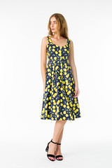 Young elegant female in light summer dress, over white background