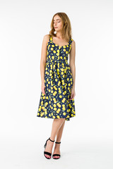 Young elegant female in light summer dress, over white background