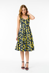 Young elegant female in light summer dress, over white background