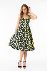 Young elegant female in light summer dress, over white background