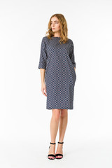 Young elegant female in light summer dress, over white background