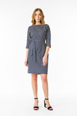 Young elegant female in light summer dress, over white background