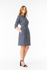 Young elegant female in light summer dress, over white background