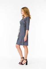 Young elegant female in light summer dress, over white background