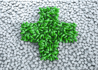 Grüne Tabletten in Kreuzform