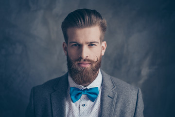 Portrait of stylish hipster brutal young man with red mustache, beard and beautiful hairstyle ready...