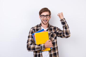 Yes! Happy handsome student in spectacles having an exelent mark for exam.