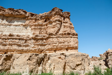 Fototapeta na wymiar A great gorge between two rocks in the desert