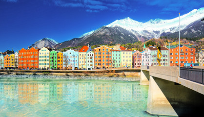 City scape in Innsbruck city center with beautiful houses, river Inn and Tyrolian Alps, Austria, Europe. - obrazy, fototapety, plakaty