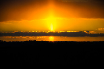 Beautiful sunset on a meadow on winter