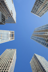 Fototapeta na wymiar Group of skyscrapers against a blue sky
