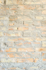 Wall of red worn brick