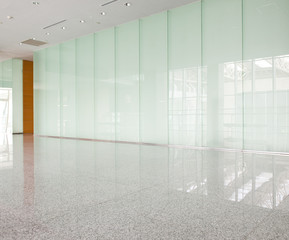 Plakat modern interior with glass wall in an office building.