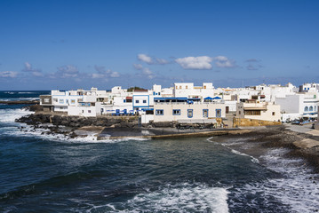 Village El Cotillo on the Canary Island Fuerteventura old harbor seafront.
