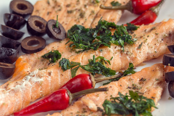 fillet of salmon with olives, herbs and spicy red pepper