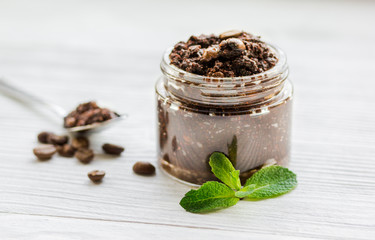 Organic spa with coffee scrub in cosmetic set on table