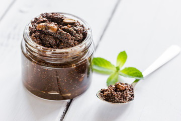 Organic scrub from ground coffee on table background