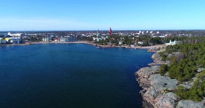 Hanko, Cinema 4k aerial flight on the coast towards the city, on a sunny spring day, in Hango, Finland