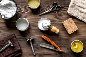 Tools for cutting beard in barbershop on workplace background top view