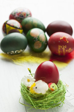Easter eggs and white wooden country table, background and texture