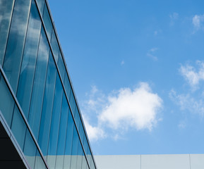Fototapeta na wymiar Modern glass silhouettes on modern building.
