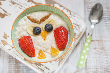 Kids breakfast porridge with fruits and nuts