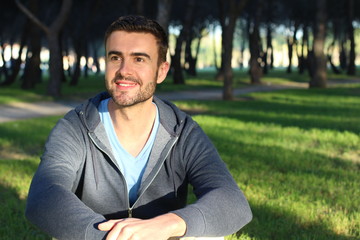 Cute thirty years old man smiling in the park 