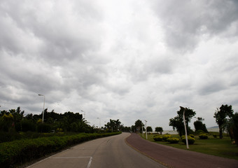 winding road with gloomy cloudscape.