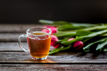 tea and milk on old wood background