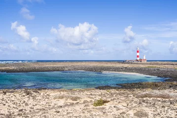 Fototapeten Lighthouse Faro del Tostón at the north cape of Fuerteventura Canary Islands near the village El Cotillo. © sotavento1000