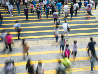Busy city people on zebra crossing street in Hong Kong, China.