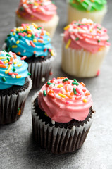 Pink Easter Muffins with Sprinkles on Granite Counter