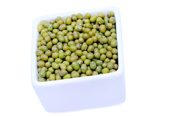 Mung beans in a bowl on white background