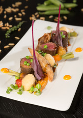 Slow cooked venison meat loin, served with carrots, peas, potatoes and squash puree.