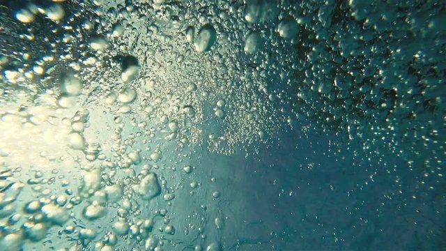 Slow motion : Air bubble Floating up to water surface 
