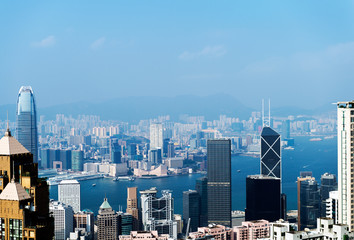 Fototapeta na wymiar Hong Kong cityscape with victoria harbour and large group of tall buildings.
