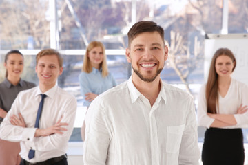 Young man with group of people on background