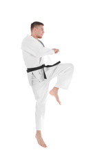 Young sporty man in kimono on white background