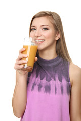 Beautiful young woman with glass of fresh juice on white background