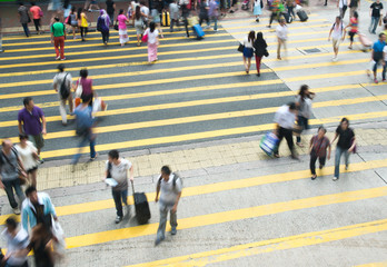 HONGKONG, CHINA - SEPTEMBER 28: Unidentified pedestrians  on zebra crossing street on SEPTEMBER 28,...