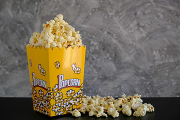 Popcorn on the table with grey background  - 142980523