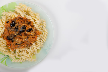 Boiled spaghetti with vegetables on a plate