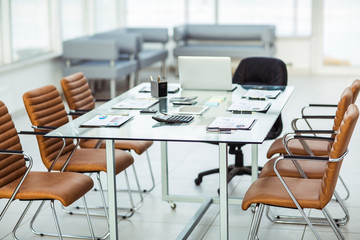 financial charts,calculators,notebook and pens laid out on the desktop before starting business negotiations