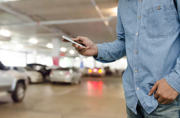 Casual young man using mobile smart phone